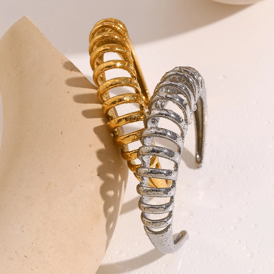 Gold or Silver Spiral Luxe Cuff Bangles for a Bold Modern Look lavixi new collection Christmas new year 2024 2025 18k gold plating