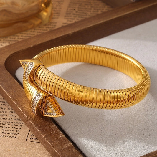 Elegant Gold Coil Bracelet - bangle with Pyramid Studs and Crystal Accents lavixi new collection 2024 2025 18k gold